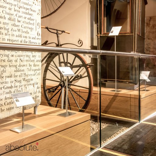 Pinnacle label holders displaying descriptive information for a museum exhibition.